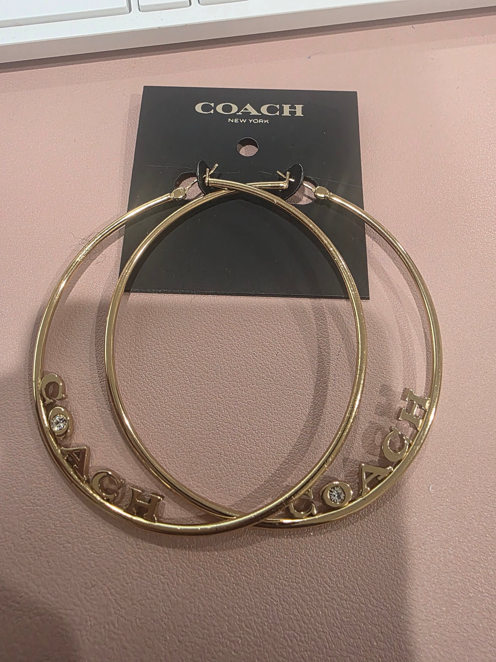 Large Gold Plated Signature Logo with Simulated Diamond Hoop Earrings